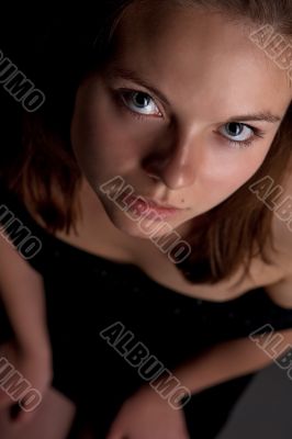 portrait of young blonde looking up