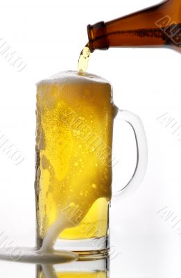 Beer flows from a glass bottle4