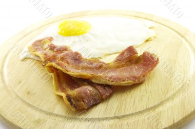 Bacon and Eggs on Wooden Plate