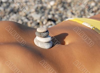 Rocks stack on stomach