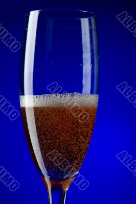 On blue champagne glasses macro On blue champagne glasses macro