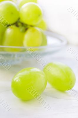 Green ripe grapes in plate