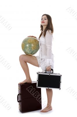 Young woman with  suitcase and globe