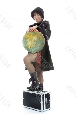 Beautiful brunette with valise and globe