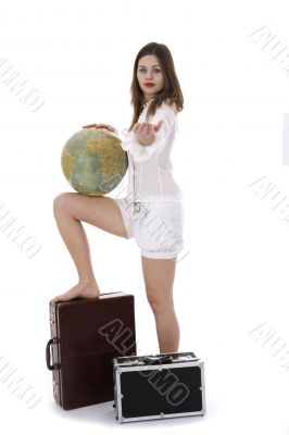 Young woman with  suitcase and globe