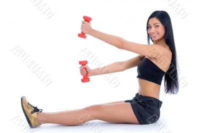 beautiful girl with dumbbells