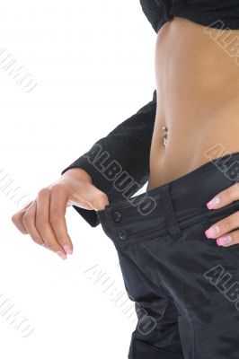 Woman showing how much weight she lo