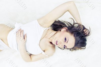 Young woman laying bed