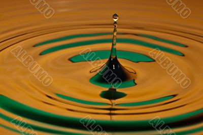 drop bouncing off a water surface
