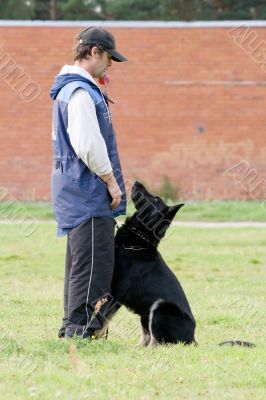 Man and Black German shepherd