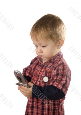 Small boy is browsing the snapshots on phone