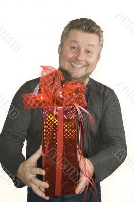 Attractive smiling man with present