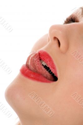 Beautiful woman leaking teeth with tongue close-up