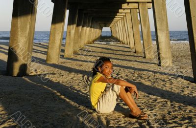 African-american Girl Sitting on Beach