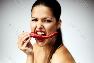 Woman with hot chili pepper
