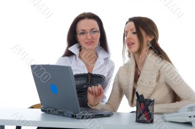 Two business woman work with laptop