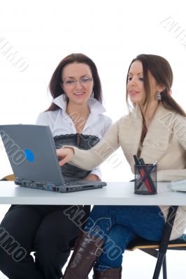 Two business woman work with laptop