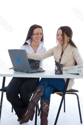 Two business woman work with laptop