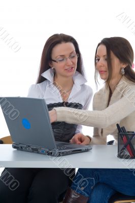 Two business woman work with laptop