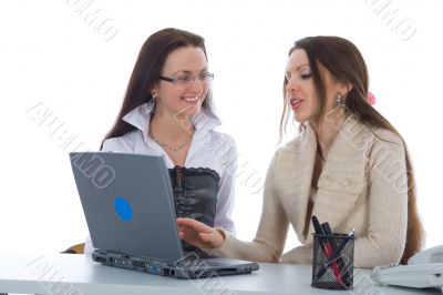 Two business woman work with laptop