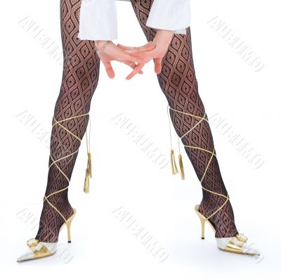 Long woman legs  in white dancing-slippers
