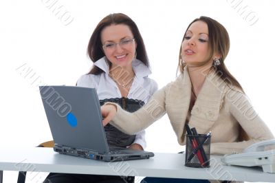 Two business woman work with laptop