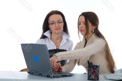 Two business woman work with laptop