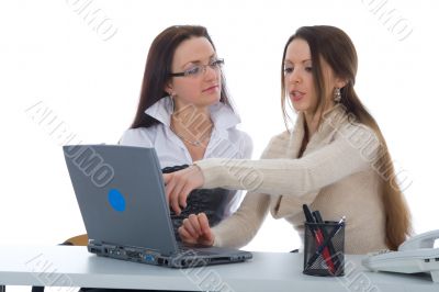 Two business woman work with laptop