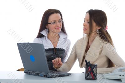 Two business woman work with laptop