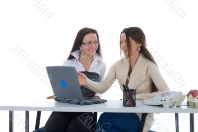 Two business woman work with laptop