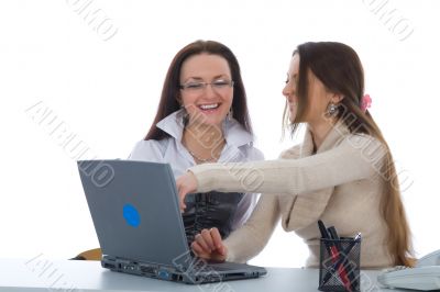 Two business woman work with laptop