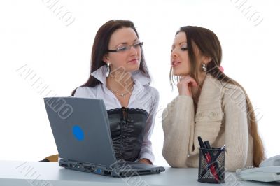 Two business woman work with laptop