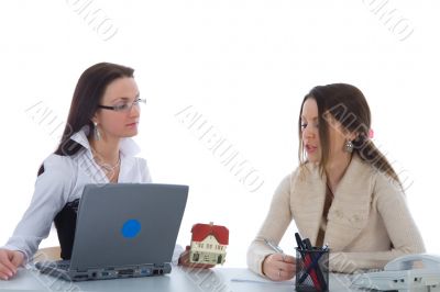 Two business woman advertises real estate on white