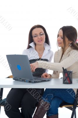 Two business woman work with laptop