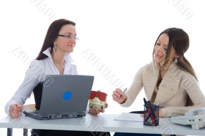 Two business woman advertises real estate on white
