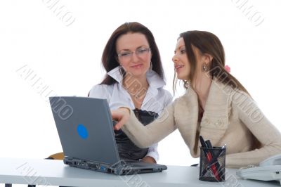 Two business woman work with laptop