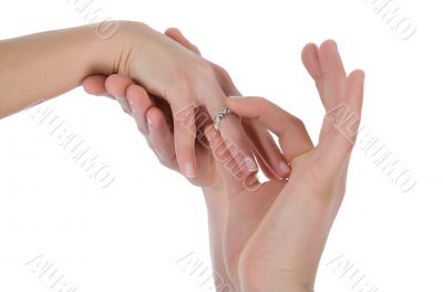 Man`s and female hands with a wedding ring