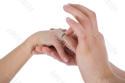 Man`s and female hands with a wedding ring