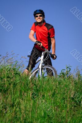 Young man with bicycle Young man with bicycle