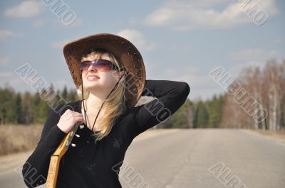 The beautiful blonde with a guitar