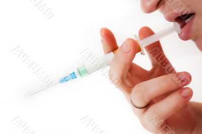 Syringe in a palm of the addict