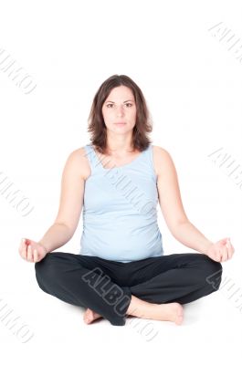 Portrait of pretty pregnant woman practicing yoga