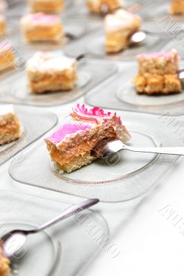 many highly decorated pieces of cake many highly decorated pieces of cake