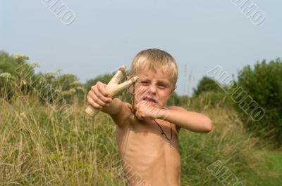 Boy with a slingshot. Boy with a slingshot.