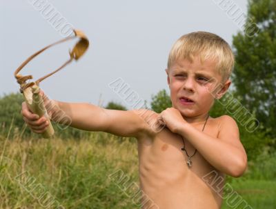 Boy with a slingshot.