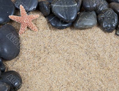 zen spa river rocks on sand in form of border