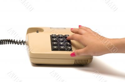 Hand and telephone. Hand and telephone.