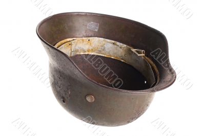 German rusty military helmet on a white German rusty military helmet on a white