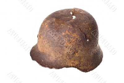 German rusty military helmet on a white