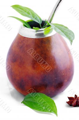  Isolated Leather Mate Cup with Straw and yerba green leafs